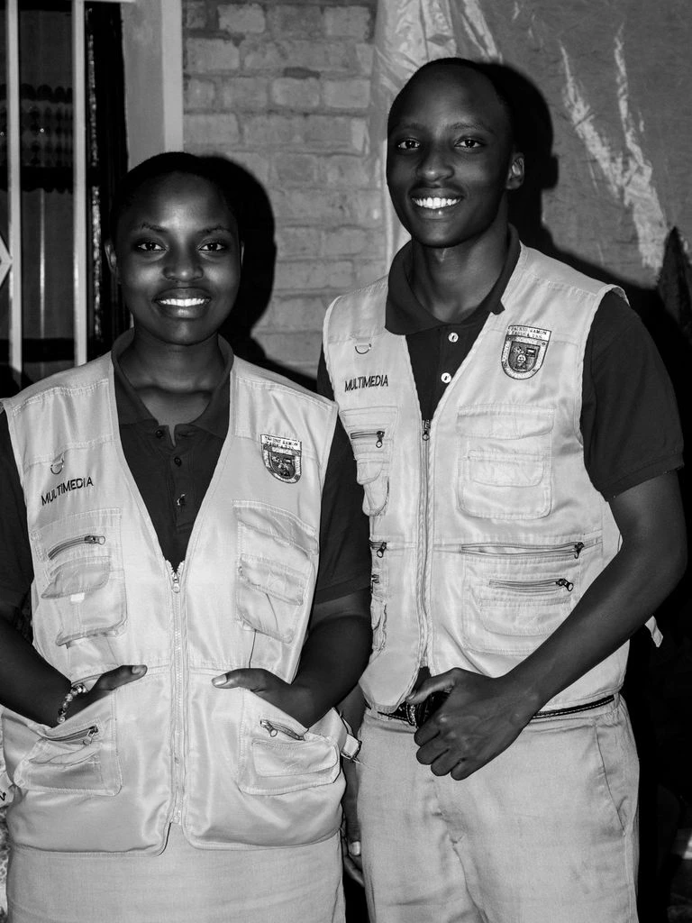 A veterinarian and a pharmacist standing together in a calm pharmacy lab.